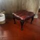 Red leather footrest in Chesterfield style, vintage 1970s.