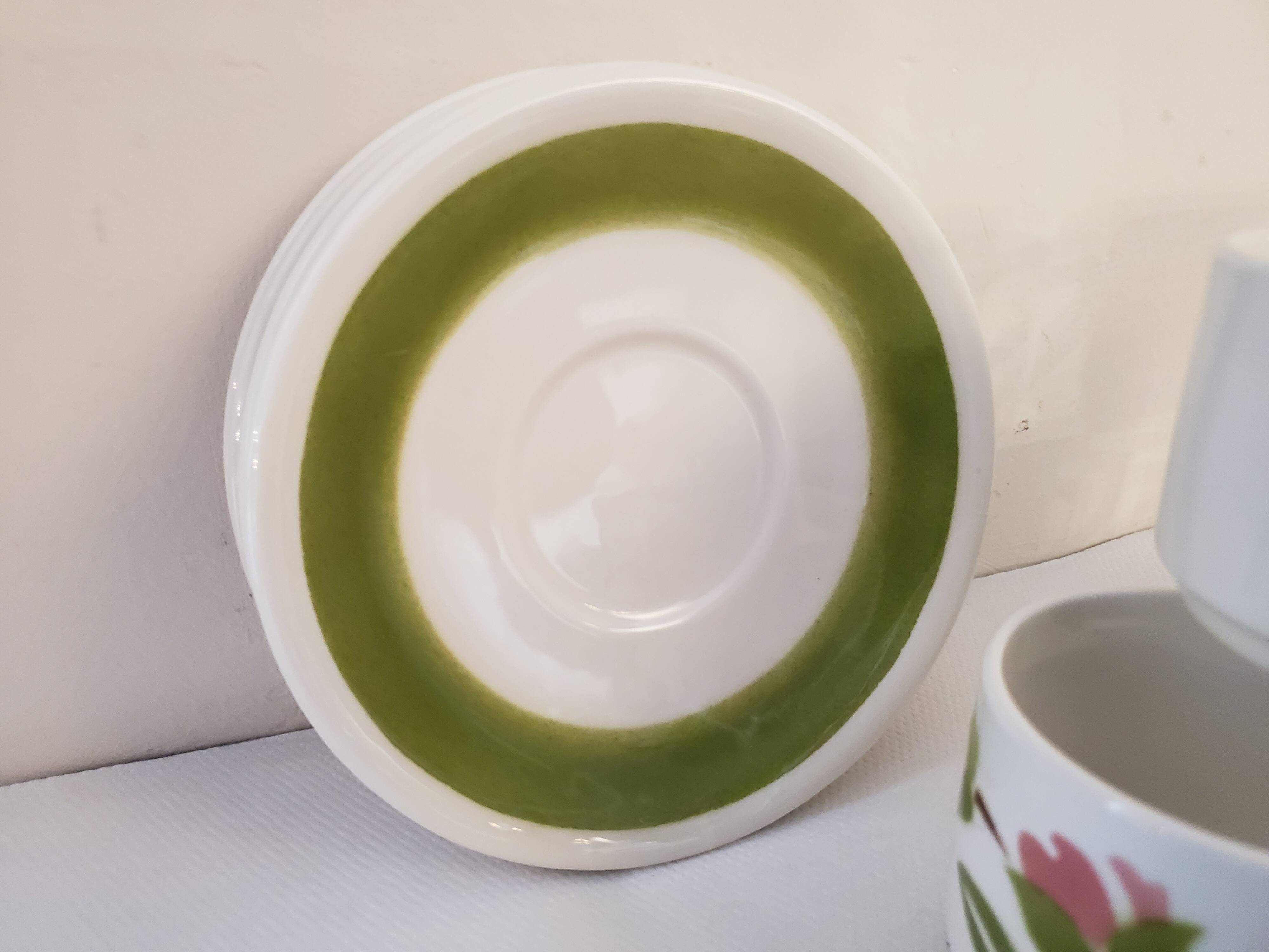 5 cups and ceramic saucers