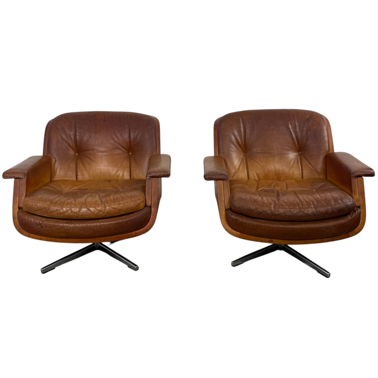 Paire de fauteuils pivotants vintage en cuir cognac par Eugen Schmidt