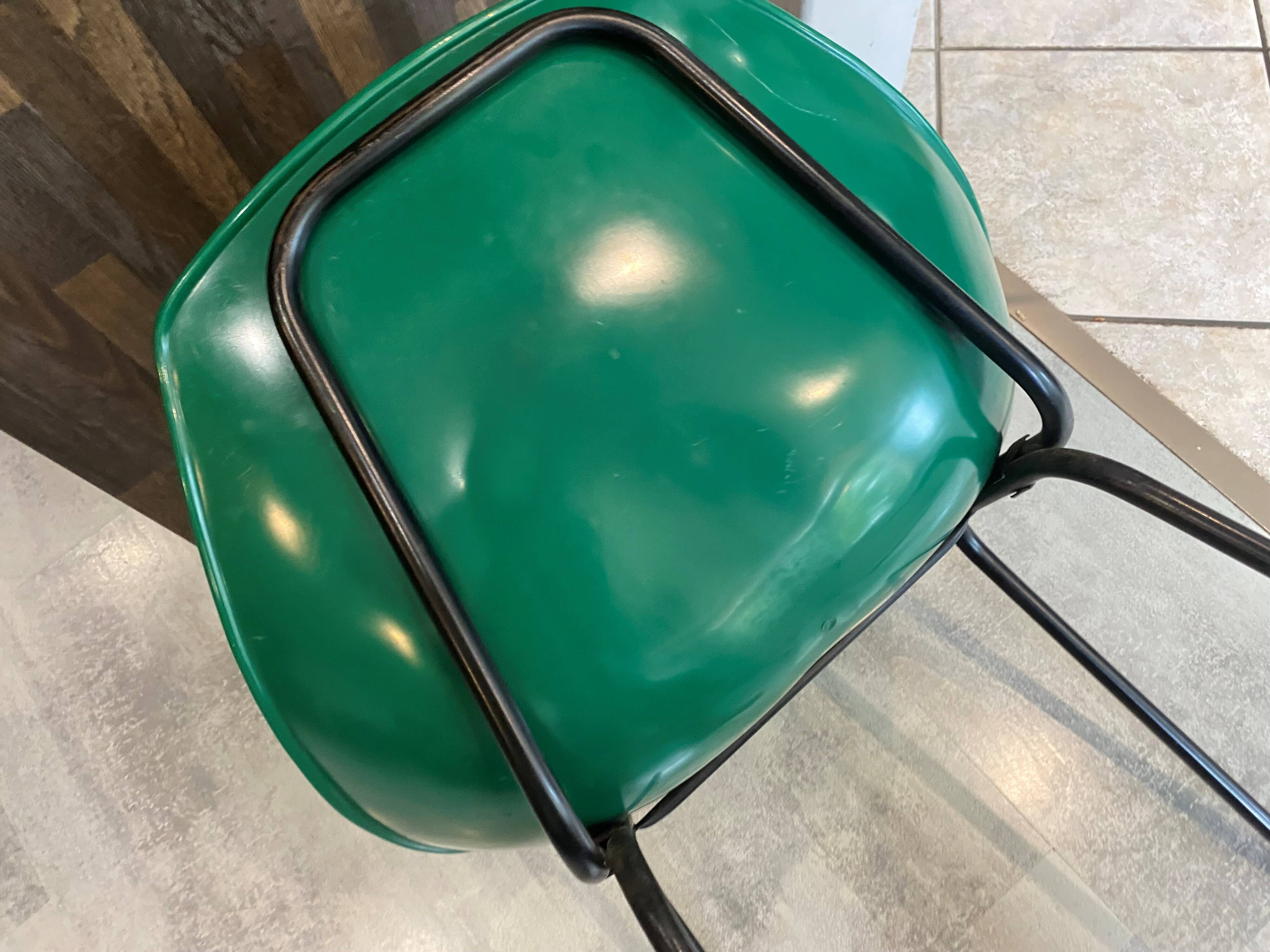 A shell chair by Pierre Guariche for Meurop in vintage green from the 1960s.
