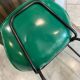 A shell chair by Pierre Guariche for Meurop in vintage green from the 1960s.