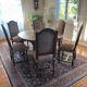 Solid oak dining table and 6 matching chairs.