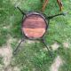 Round table and wrought iron chair