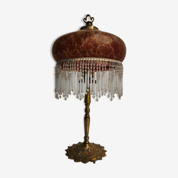 Brass lamp with amber glass paste shade and golden reflections