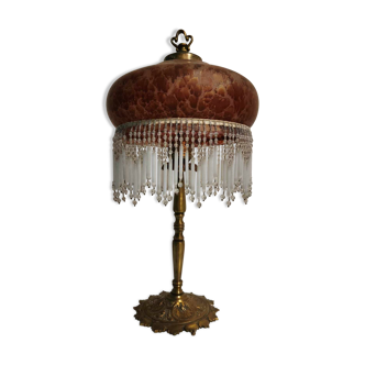 Brass lamp with amber glass paste shade and golden reflections