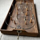 Wooden spinning top and skittles collection game