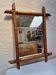 Vintage wooden mirror imitating bamboo