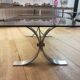 Table basse en acier brossé et verre fumé