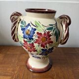 Ceramic vase with hand-painted floral decoration.