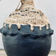 Pot en argile et raphia