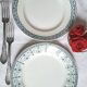 Mismatched antique flat plates made of ironstone pottery.