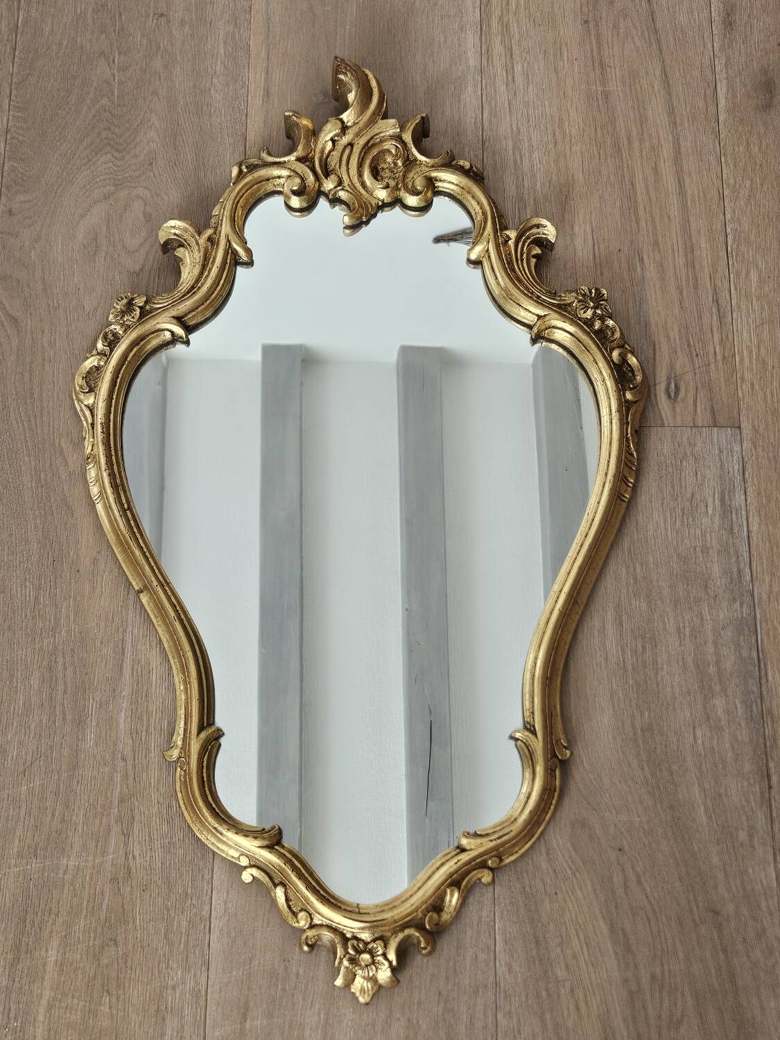 Rockery mirror under gilded frame