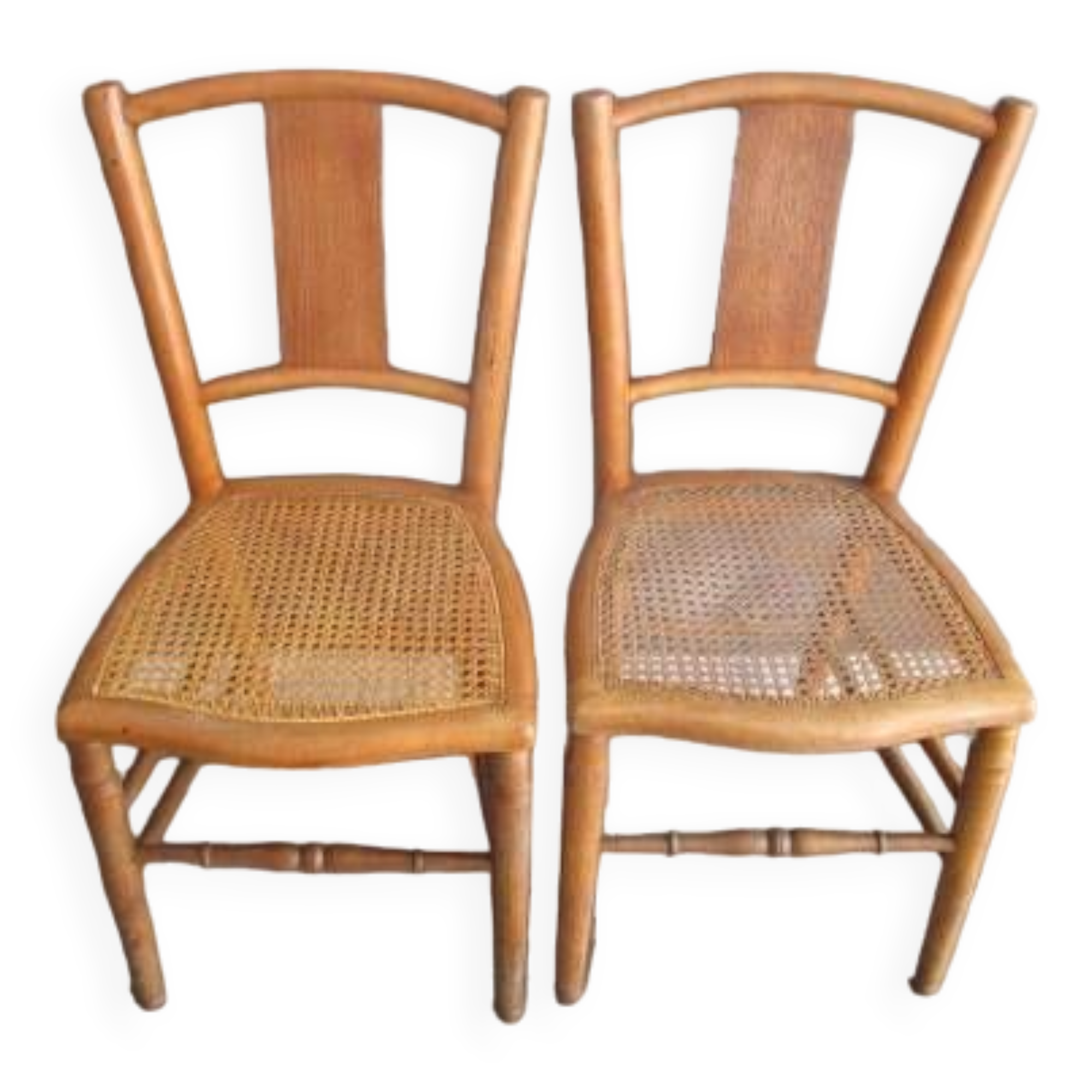 Pair of old caned chairs in blond wood