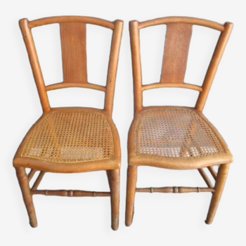 Pair of old caned chairs in blond wood