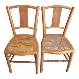 Pair of old caned chairs in blond wood