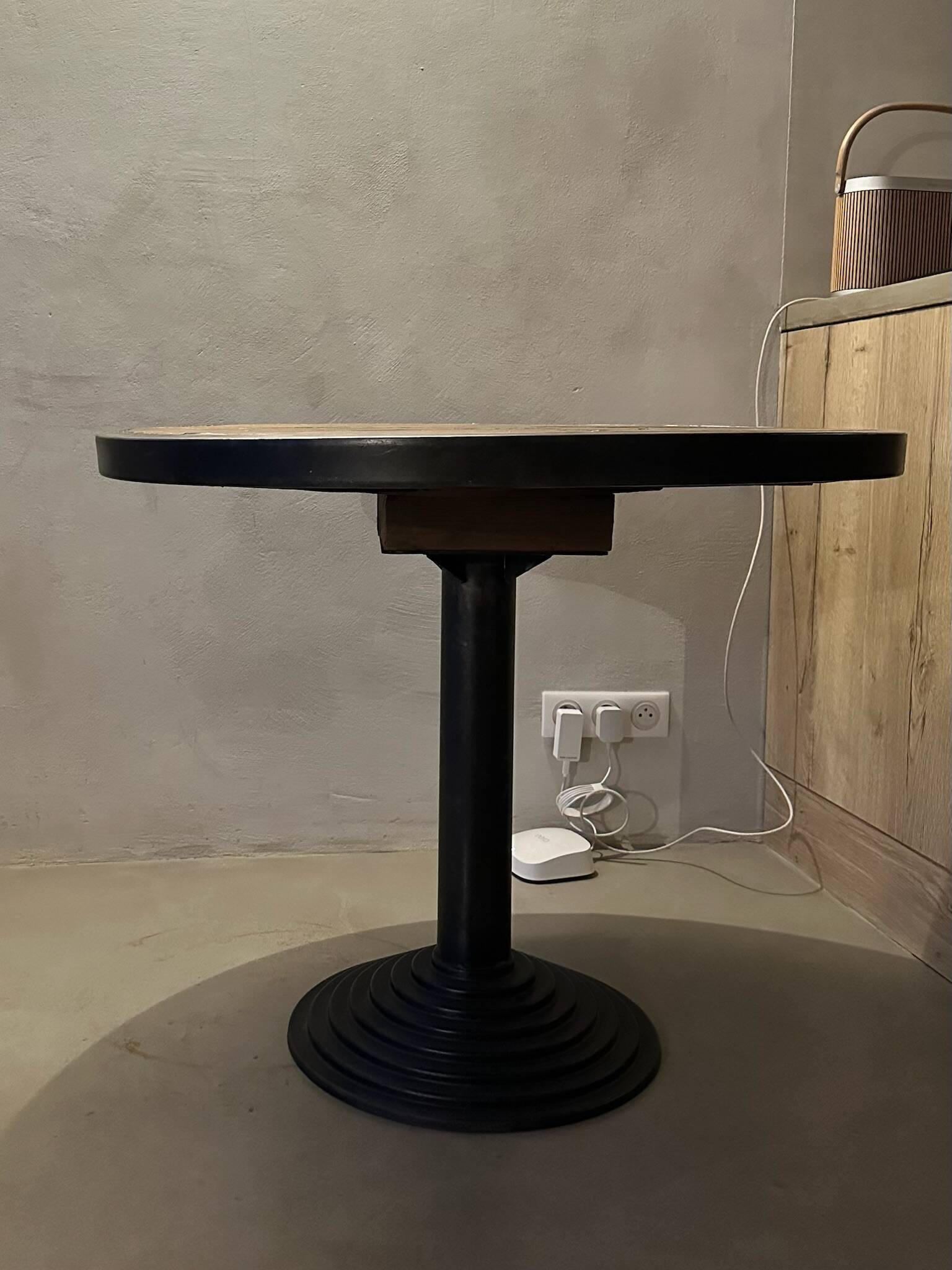 Old bistro round table / workshop – wooden top with metal rim – foot