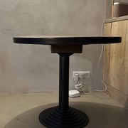 Antique bistro/atelier round table – wooden top with metal rim – foot