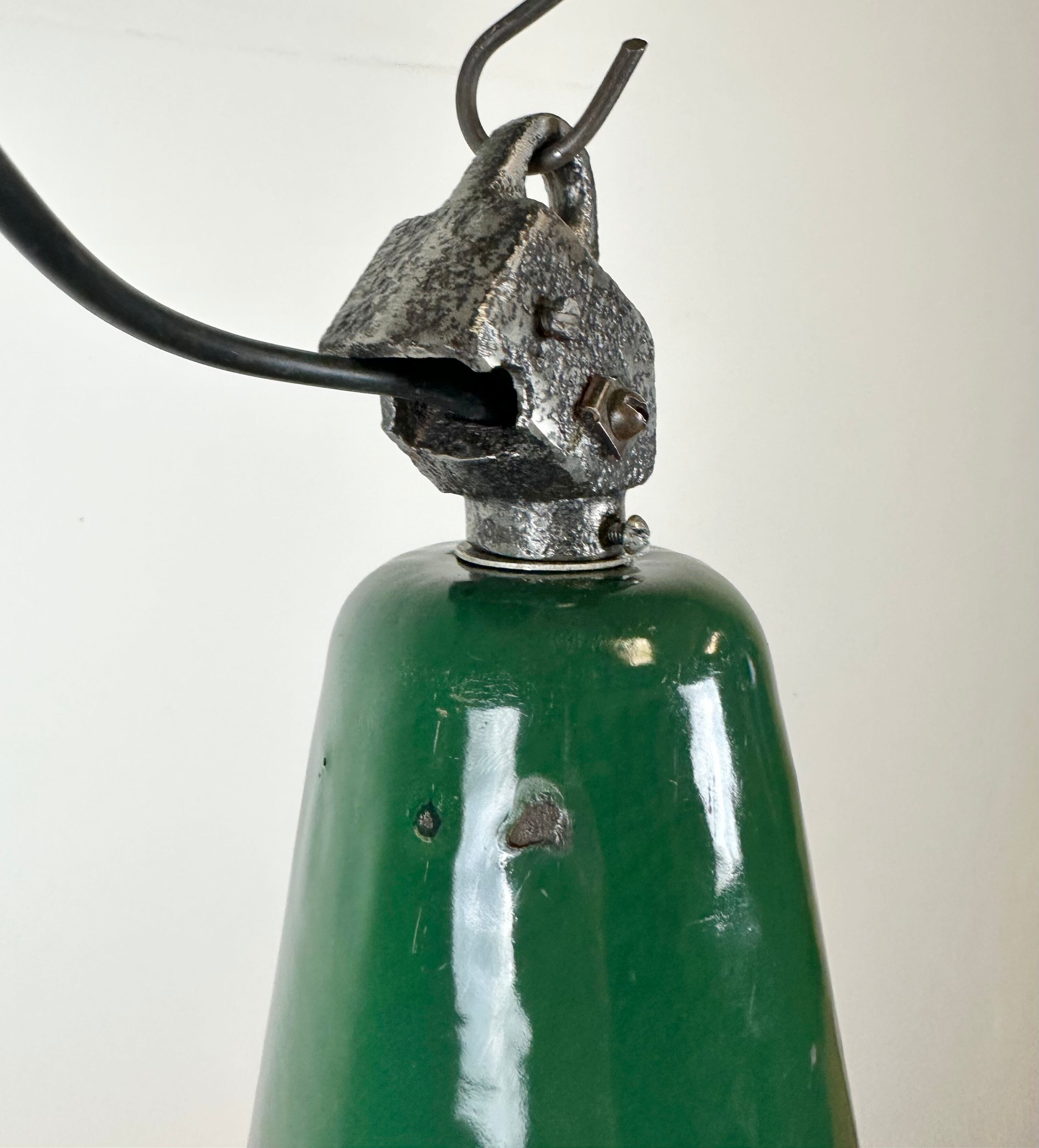 Industrial green enamel factory lamp with cast iron top, 1960s