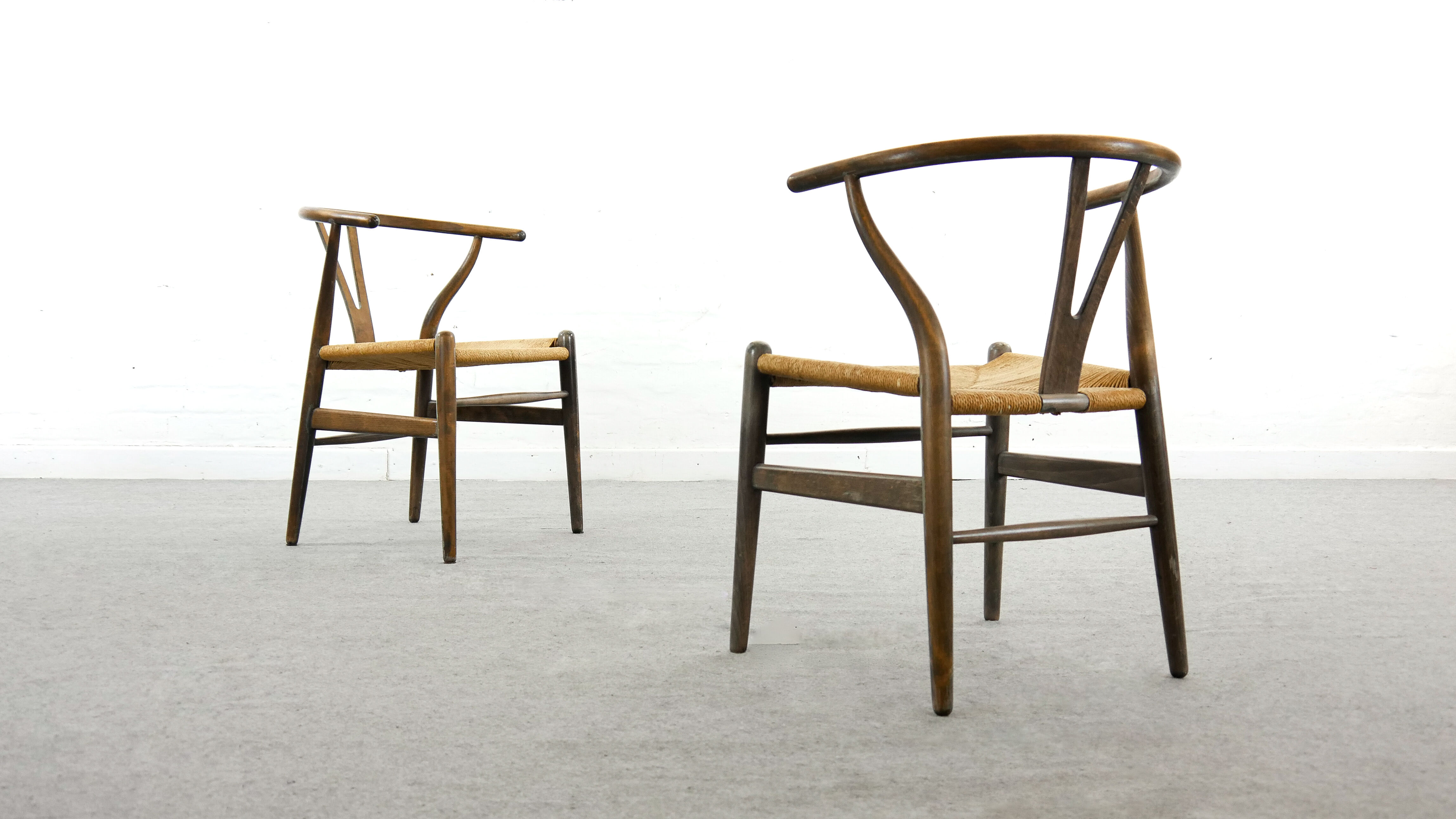 Pair of CH24 wishbone dining chairs by Hans Wegner for Carl Hansen Denmark