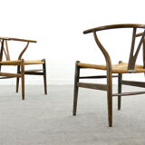 Pair of CH24 wishbone dining chairs by Hans Wegner for Carl Hansen Denmark