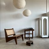 Reclined armchair in canned teak in natural wood