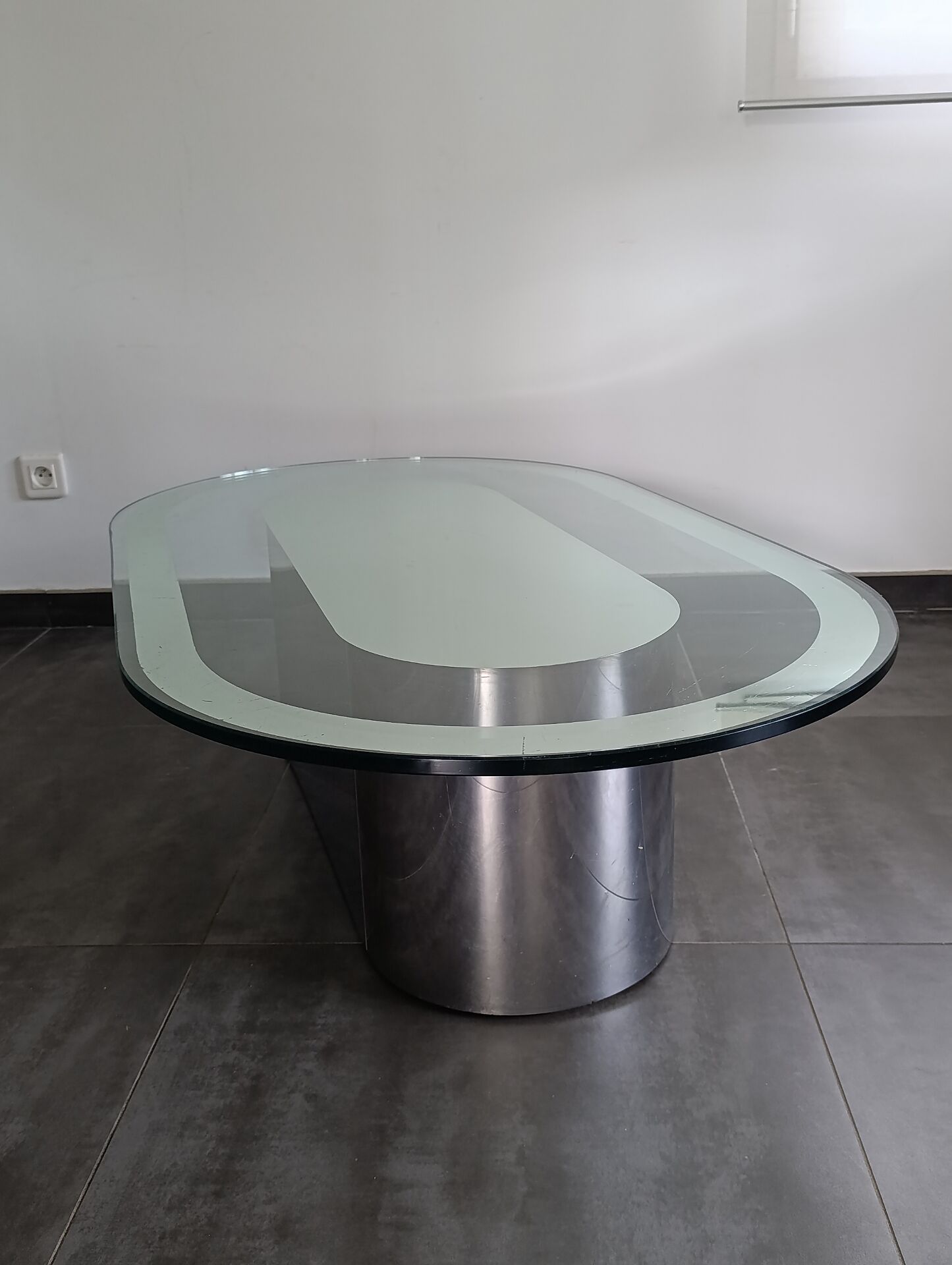 Vintage coffee table with glass and chrome metal.