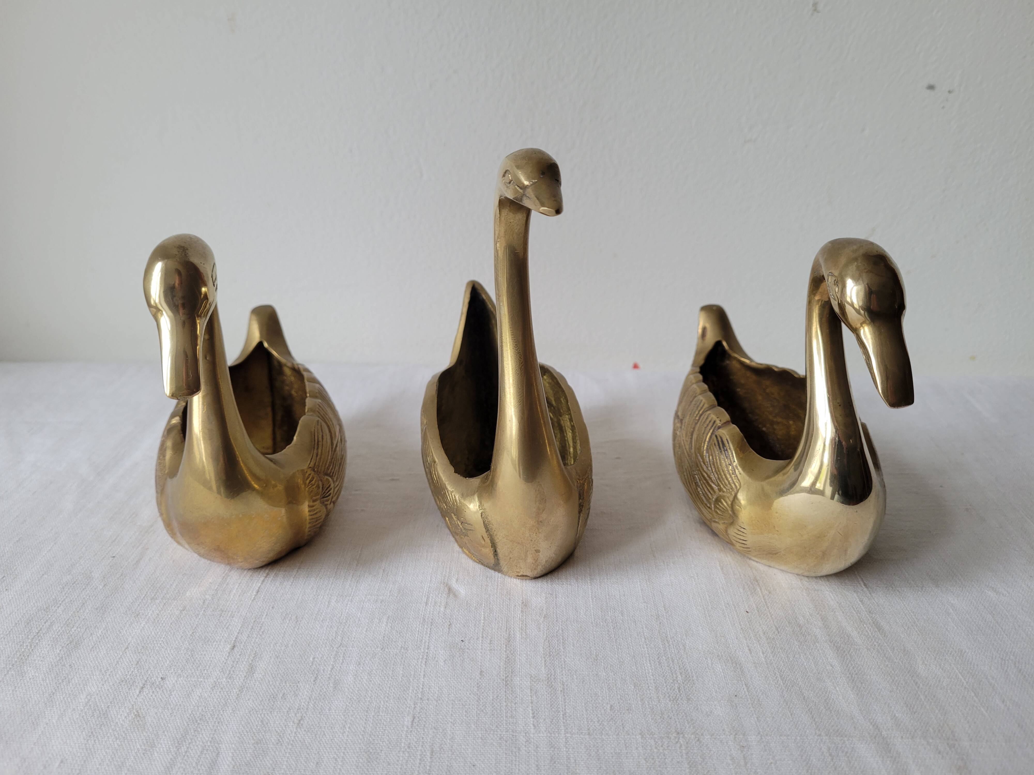 Trio of zoomorphic brass swan empty pockets