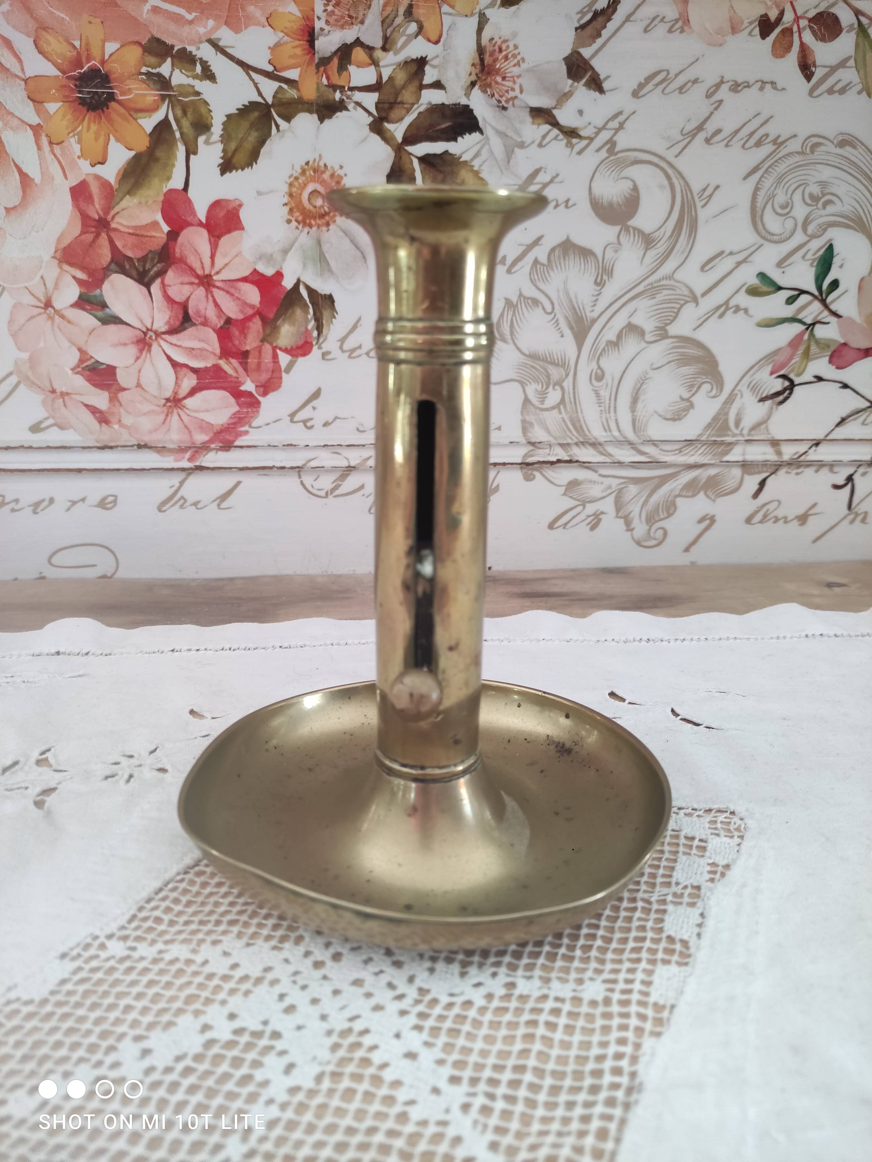 Brass push candle holder on frame
