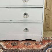 English chest of drawers painted in fir with glass knobs, 19th century