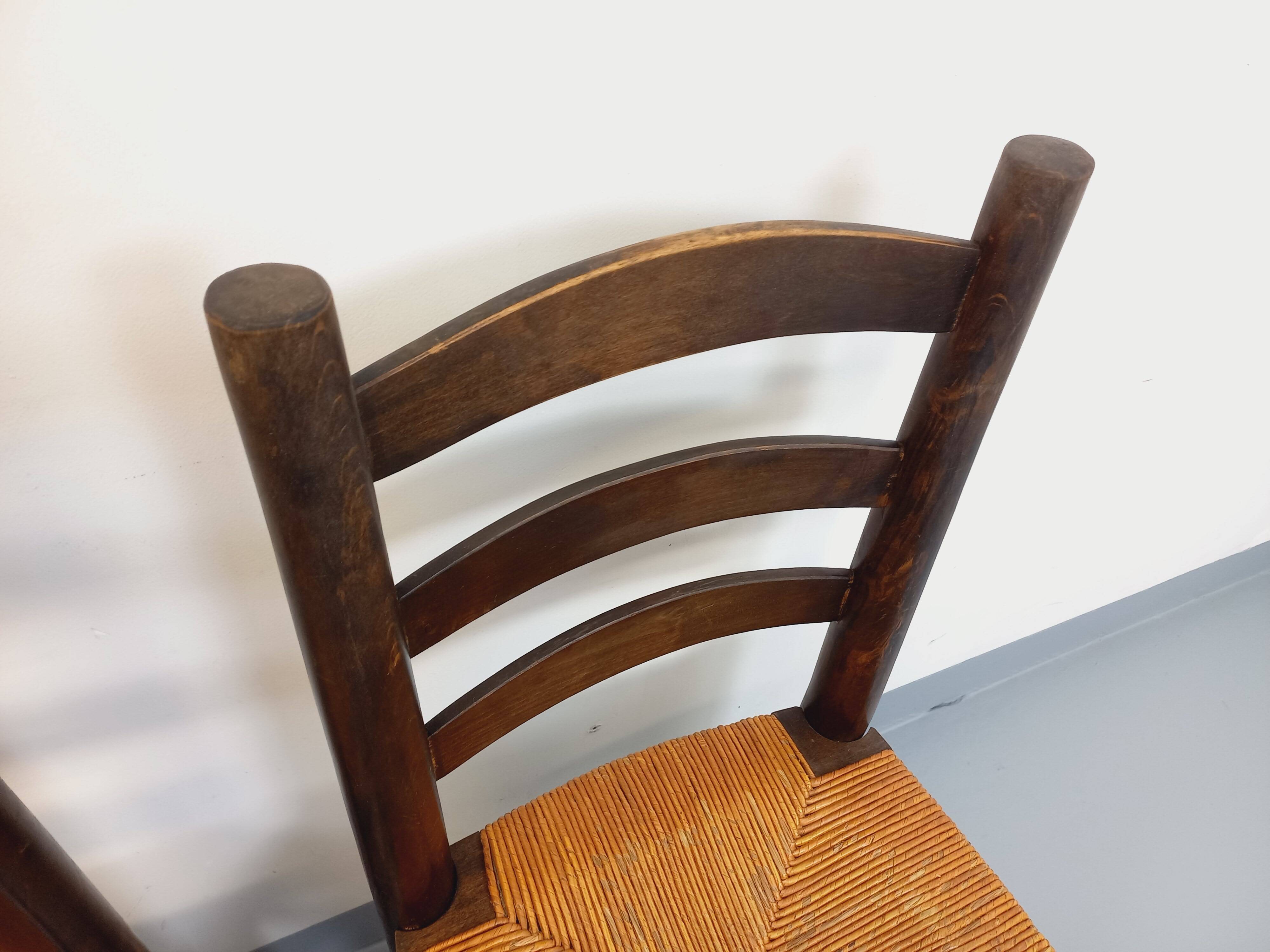 Set of 4 vintage brutalist chairs by Georges Robert in wood and straw.