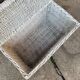 Vintage white wicker chest with double lid and decorative weaving.