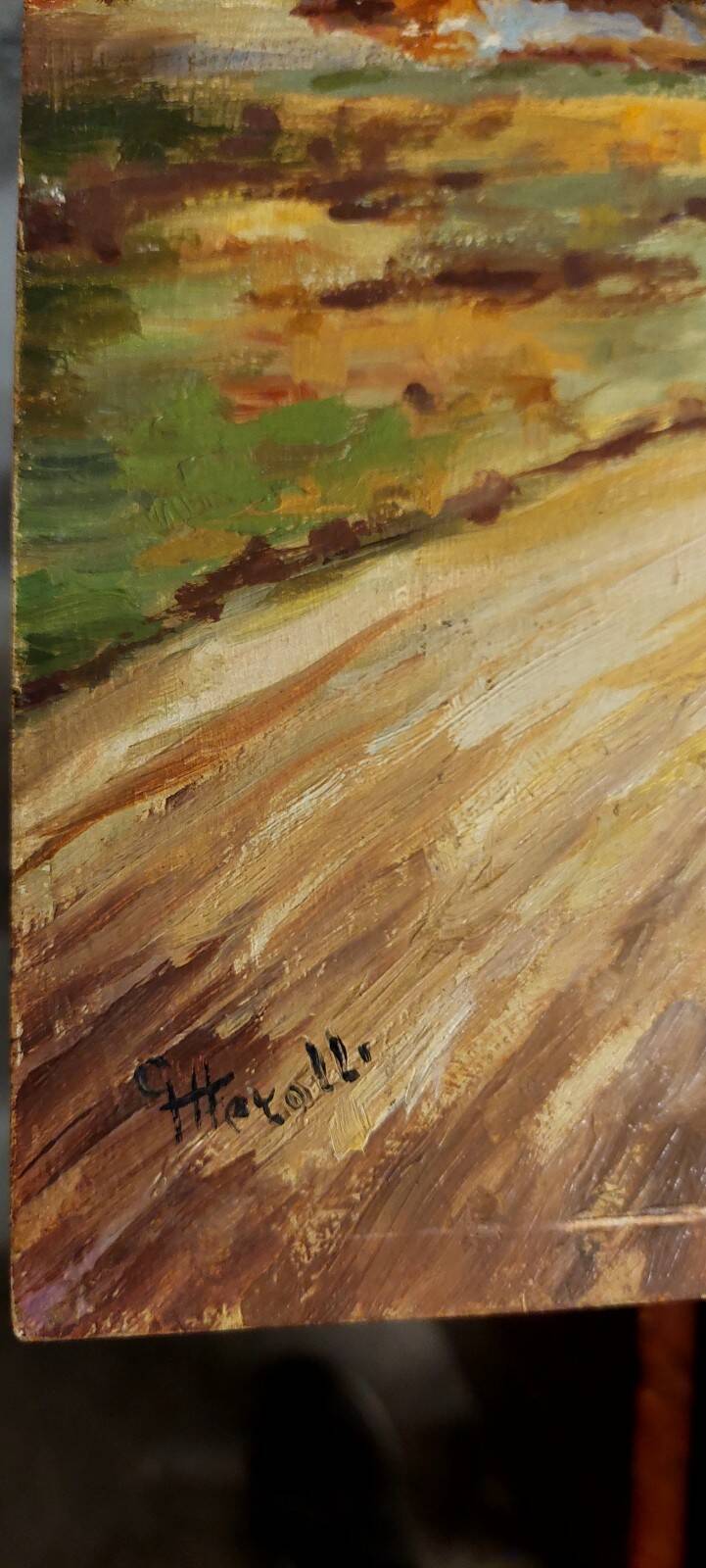 Oil painting on panel of a rural landscape, signed.