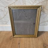Golden wooden frame with floral patterns