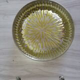 Empty round pockets of iridescent transparent glass of yellow sticks