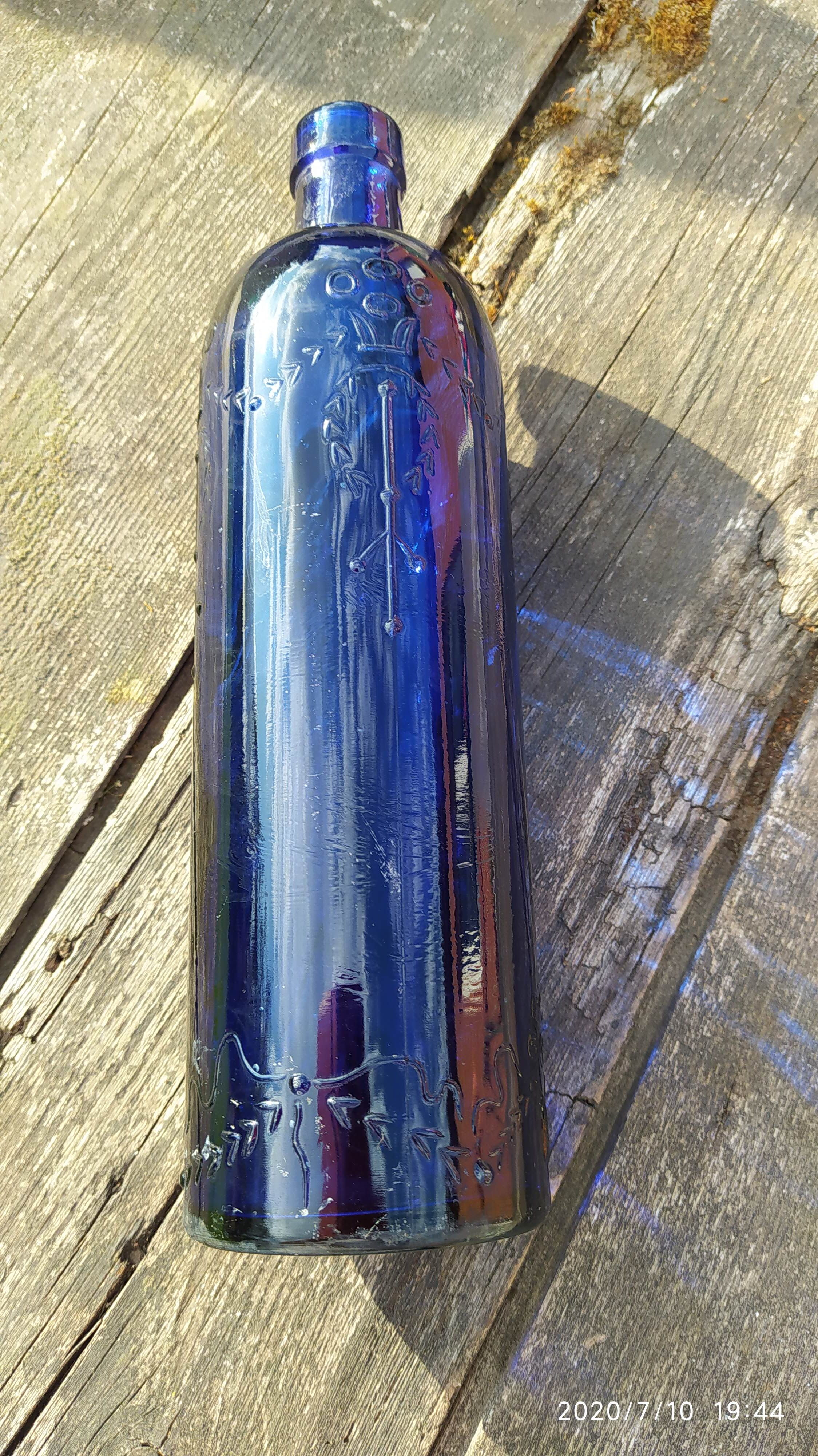 Vintage decorated glass bottle
