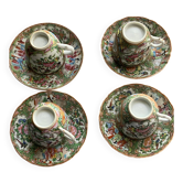 Four coffee cups and matching saucers in porcelain.