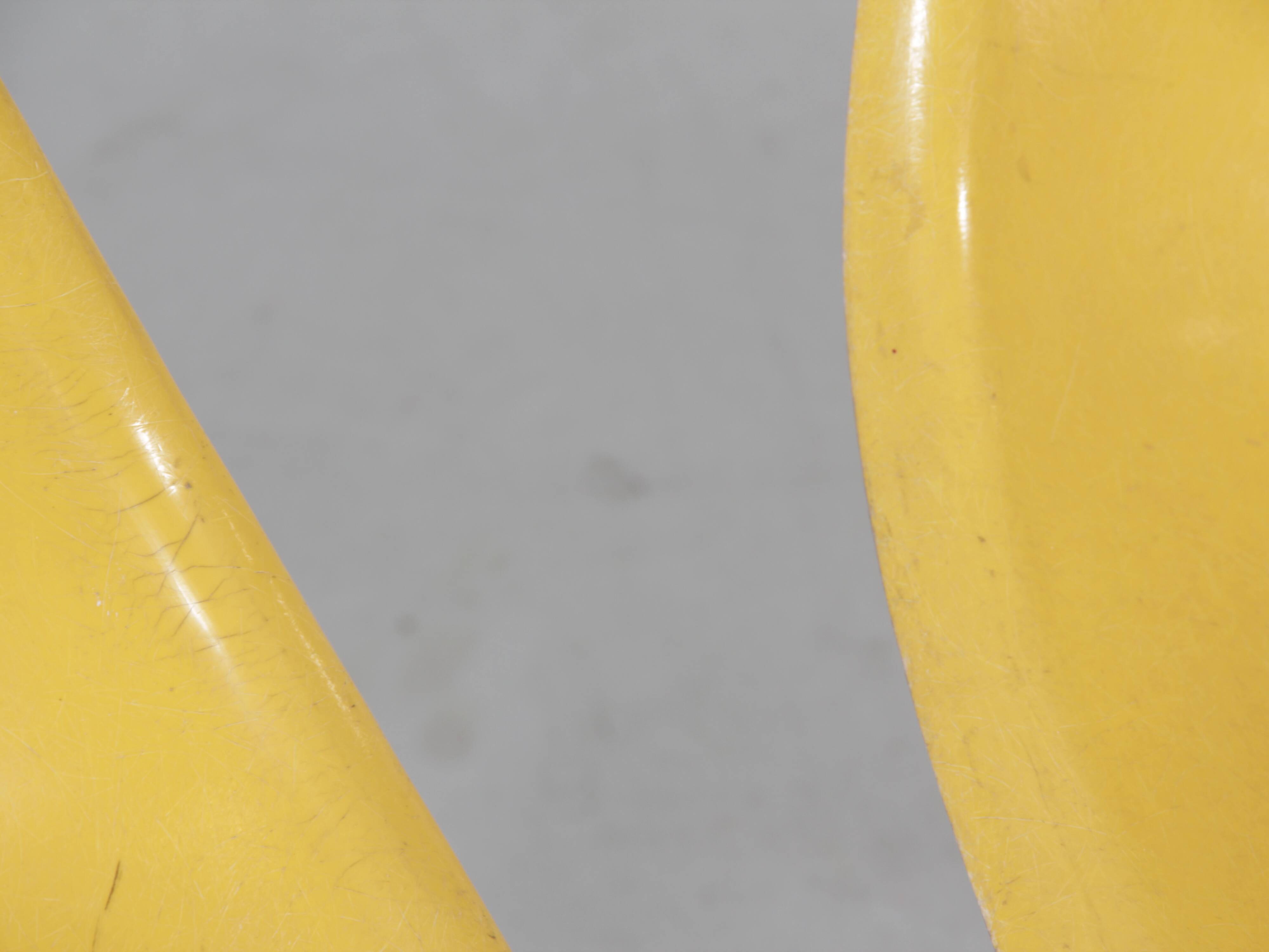 Set of 4 DSW chairs by Charles Eames - yellow fibreglass edition by Herman.