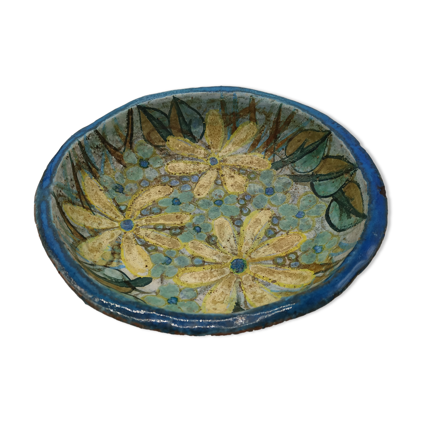 Hollow cut in blue enamelled sandstone decorated with yellow flowers