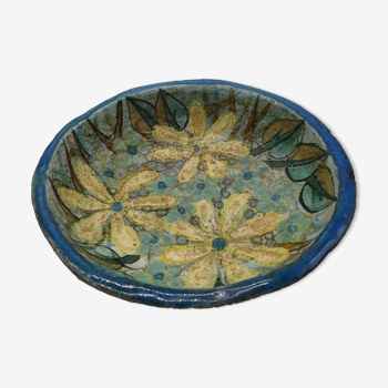 Hollow cut in blue enamelled sandstone decorated with yellow flowers