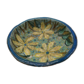 Hollow cut in blue enamelled sandstone decorated with yellow flowers