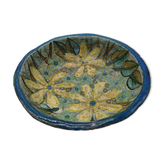 Hollow cut in blue enamelled sandstone decorated with yellow flowers