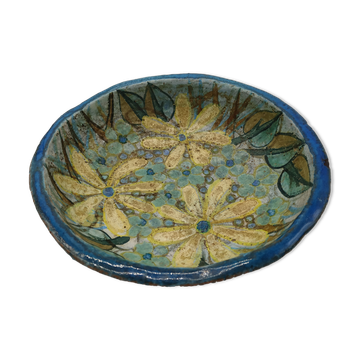 Hollow cut in blue enamelled sandstone decorated with yellow flowers