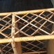 Colonial style rattan wall shelf