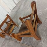 Armchairs in leather and vintage wood 70's