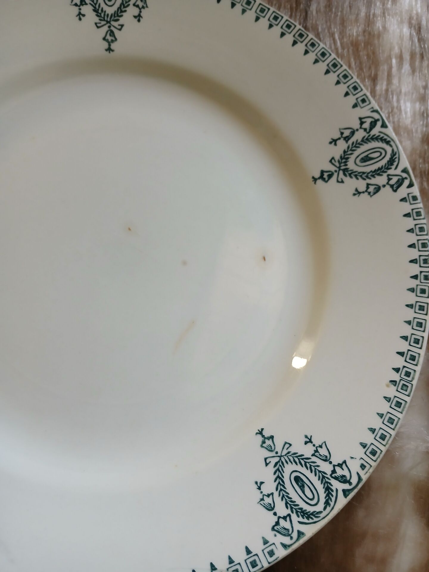 13 mismatched flat plates in ironstone