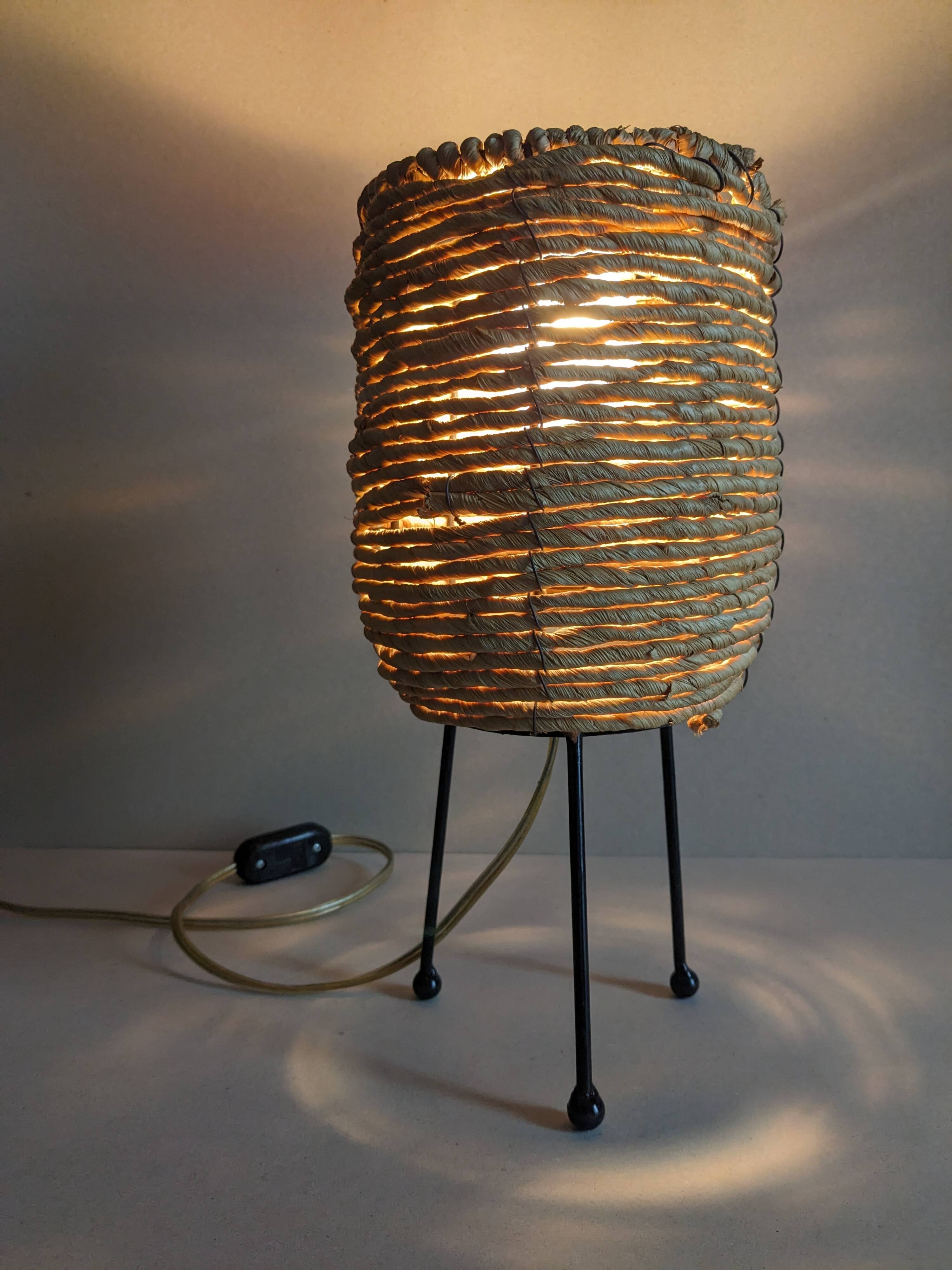 Fiber and metal tripod lamp