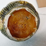 Pitcher dabbling in butterfly and flower decoration