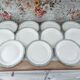 Set of 11 Longwy France earthenware dinner plates, Trianon model