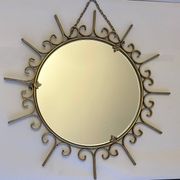 Miroir soleil en métal doré