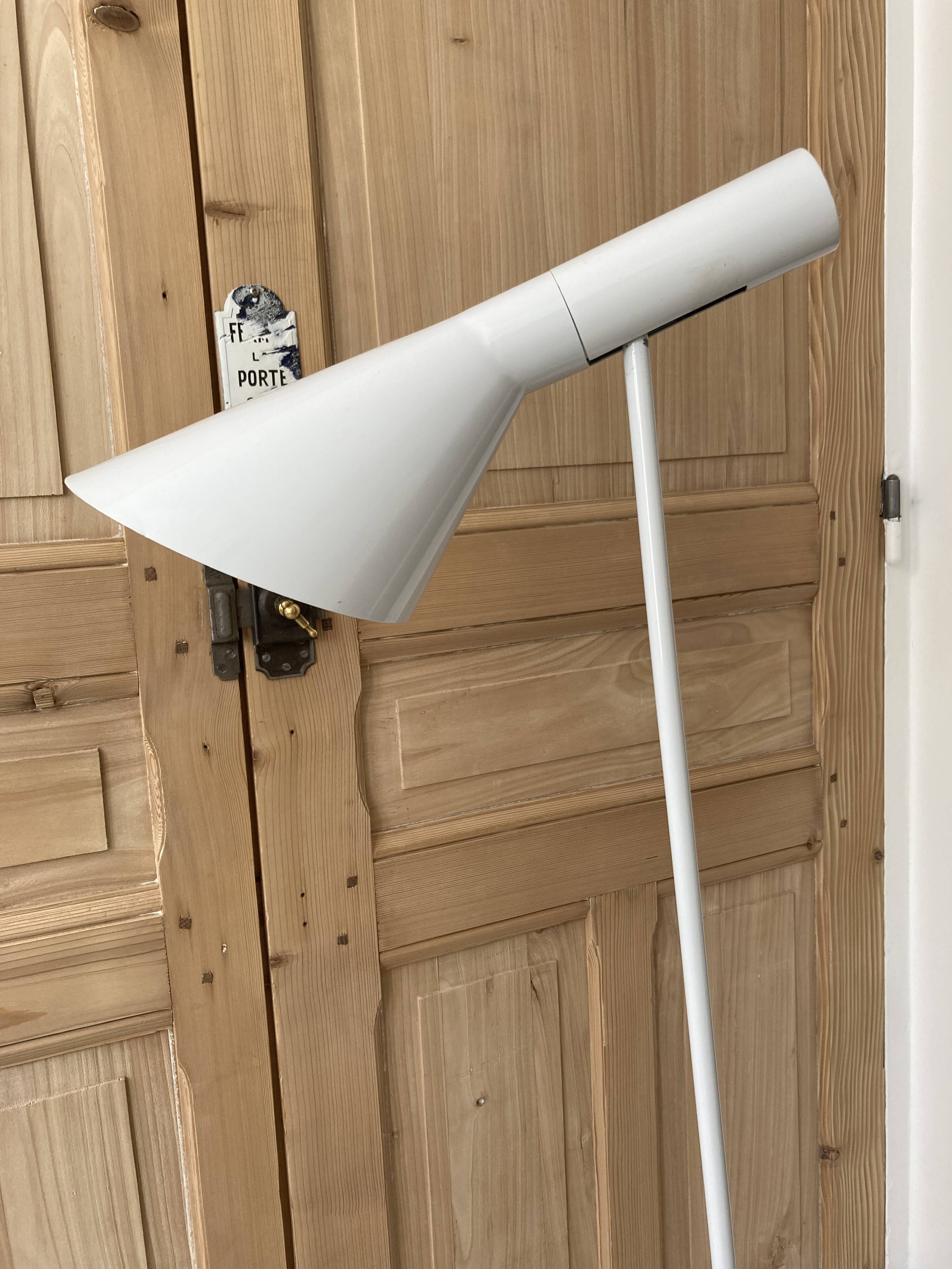 white lacquered metal reading lamp